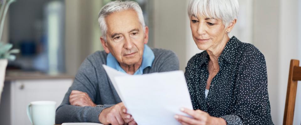 Two people reading a document