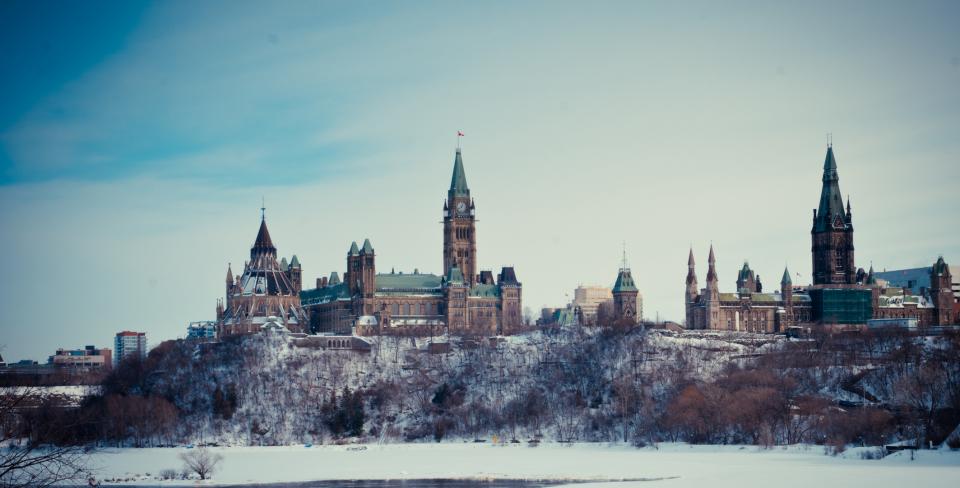 Photos of the Canadian Parliament buildings in early winter, taken from the river. 